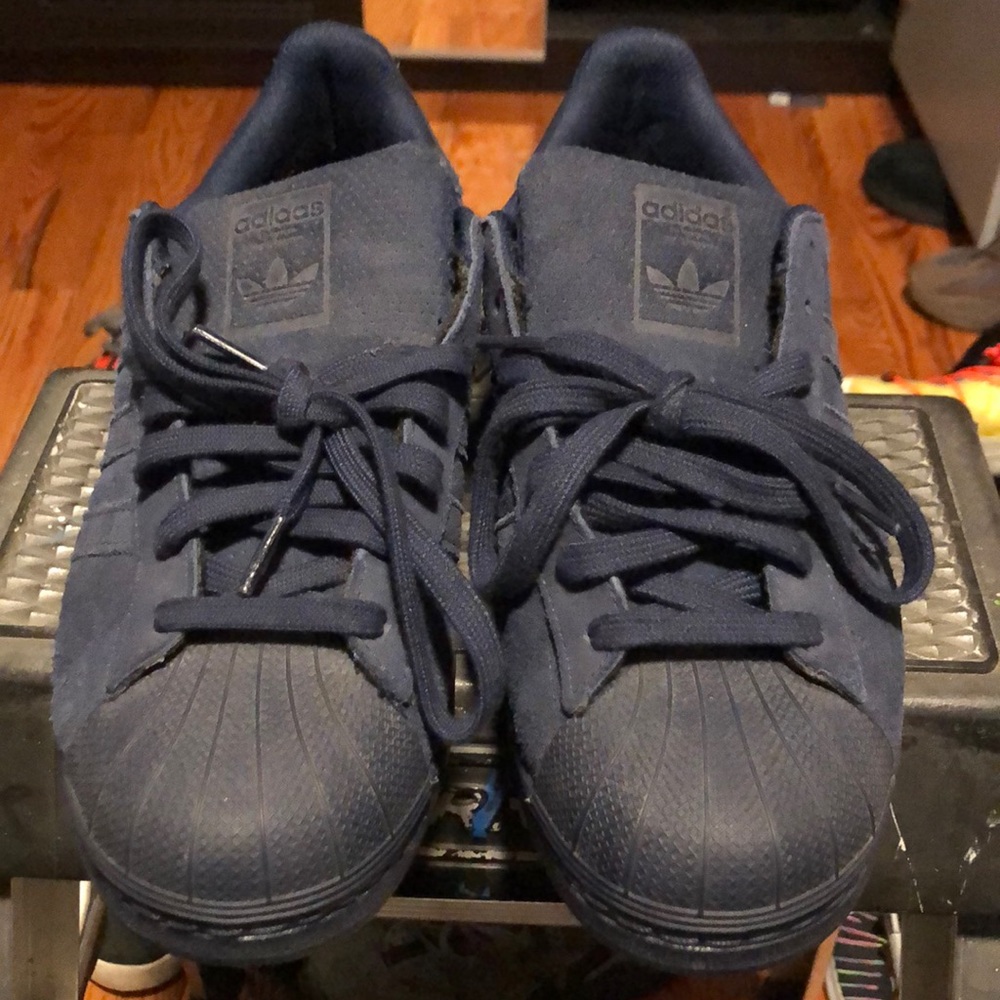 Navy suede shell toe adidas sneakers